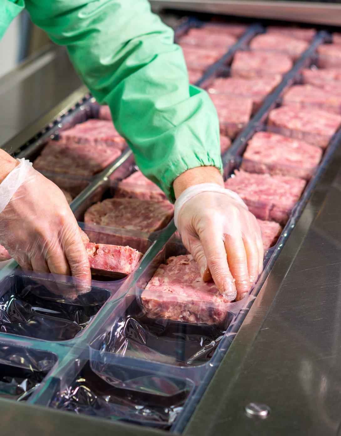 Manufacturing customer preparing Teys meat